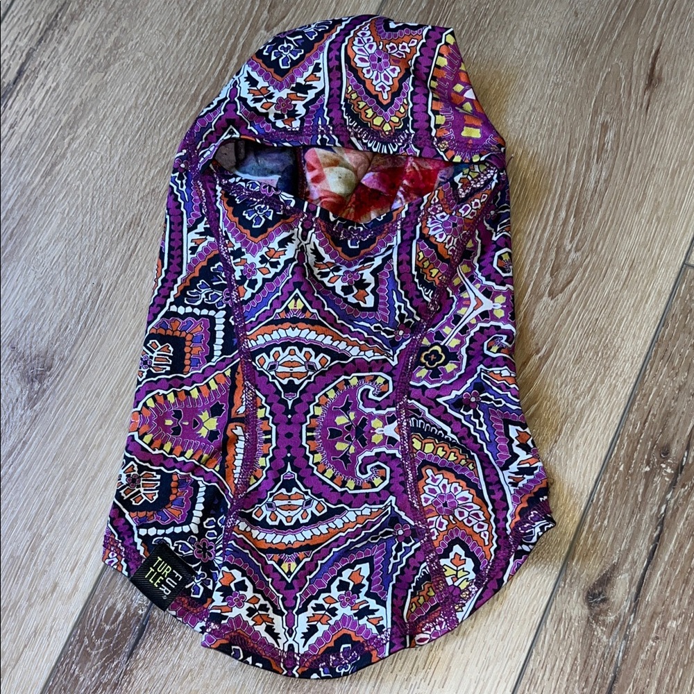 Vibrant Hooded Top with Intricate Patterns by turtle fur brand